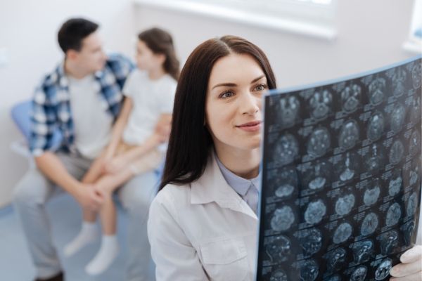 Woman neurologist reads imaging study