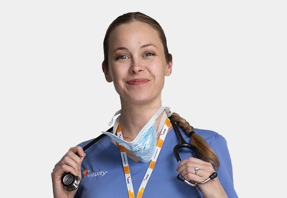 smiling female vituity physician in scrubs 