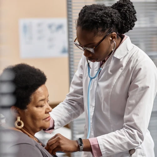 Medical professionals examining patient heart