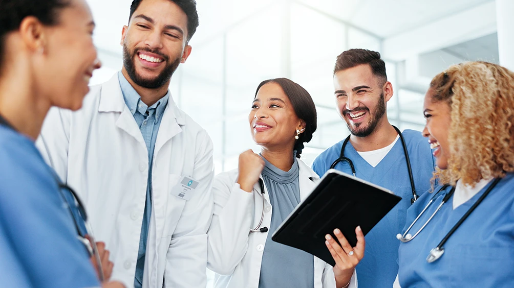 Group of smiling attending physicians